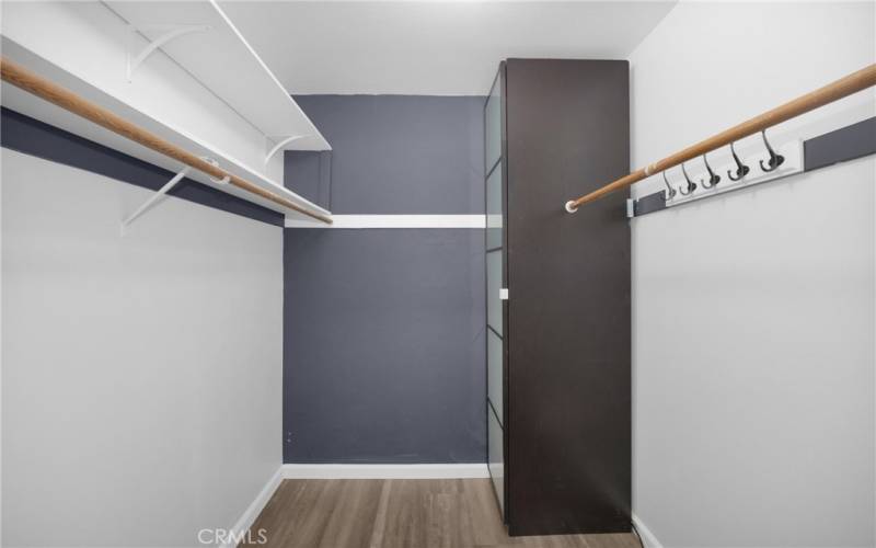 Primary bedroom walk-in closet