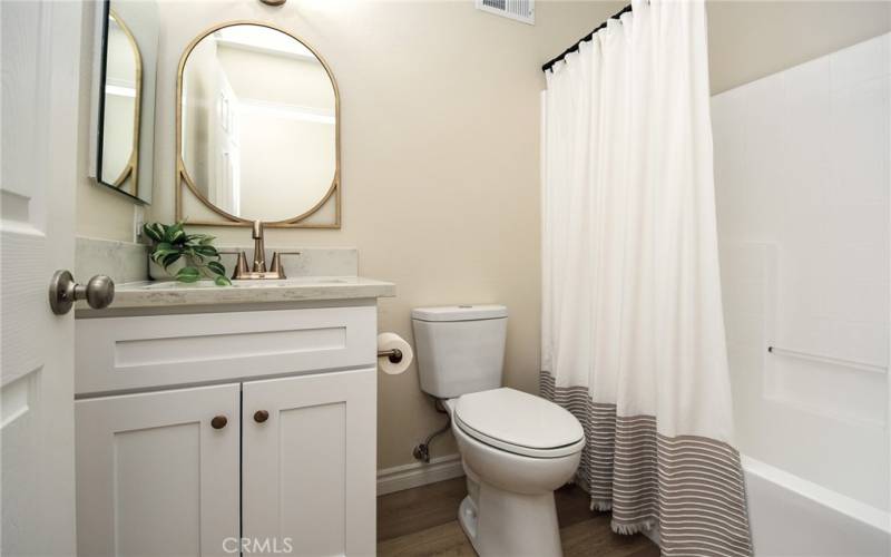 Guest bath with brand new flooring, paint, electrical and bath fixtures.