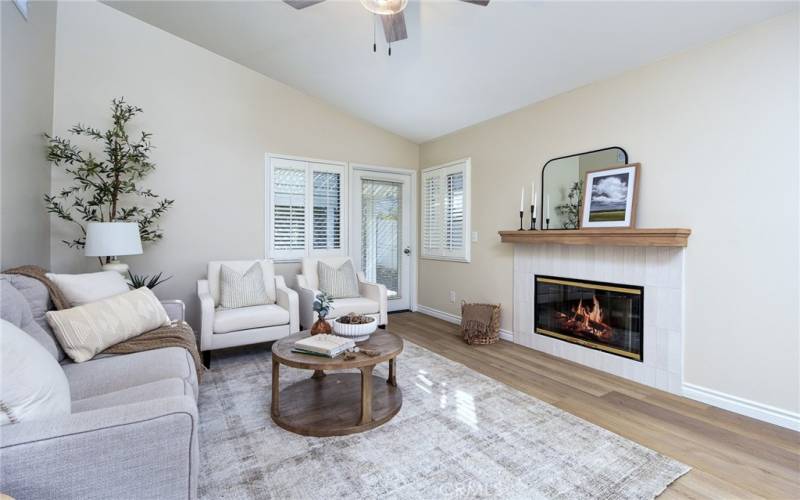 New paint, flooring and trim. Fireplace has been updated with  a new tile surround and hearth.