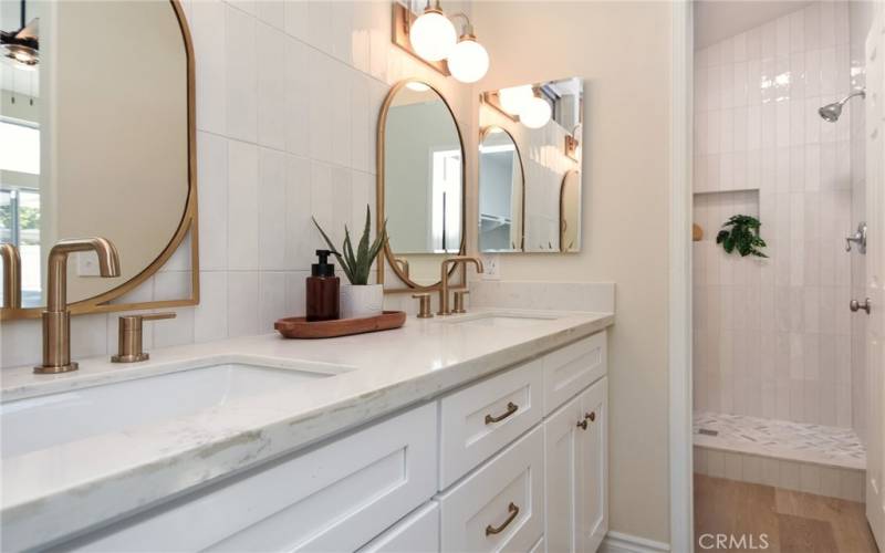 Double sink vanity in the master with upgraded Delta faucets in a champagne bronze finish.