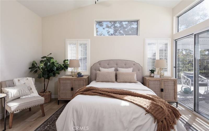 Large primary bedroom with plenty of natural light.