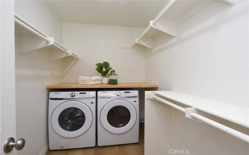 Conveniently located laundry room in the primary closet. Brand new washer and dryer included with the home.