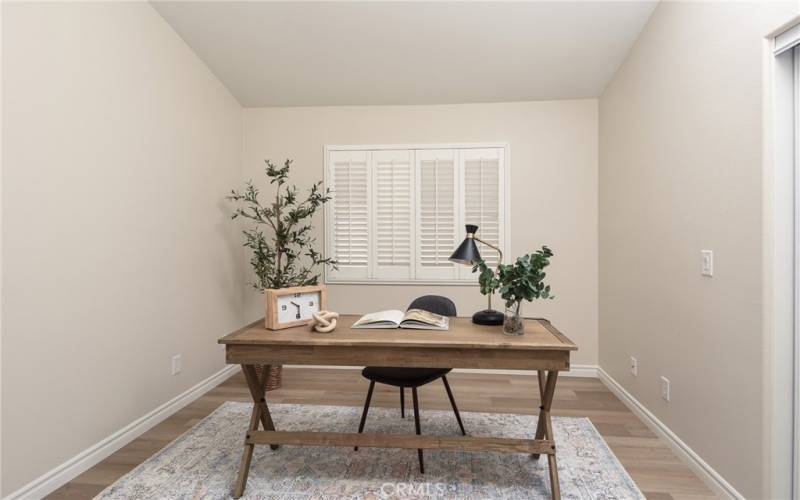 Secondary bedroom staged as office.