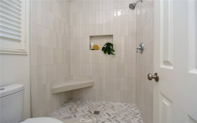 New, modern tile work in the primary bathroom.