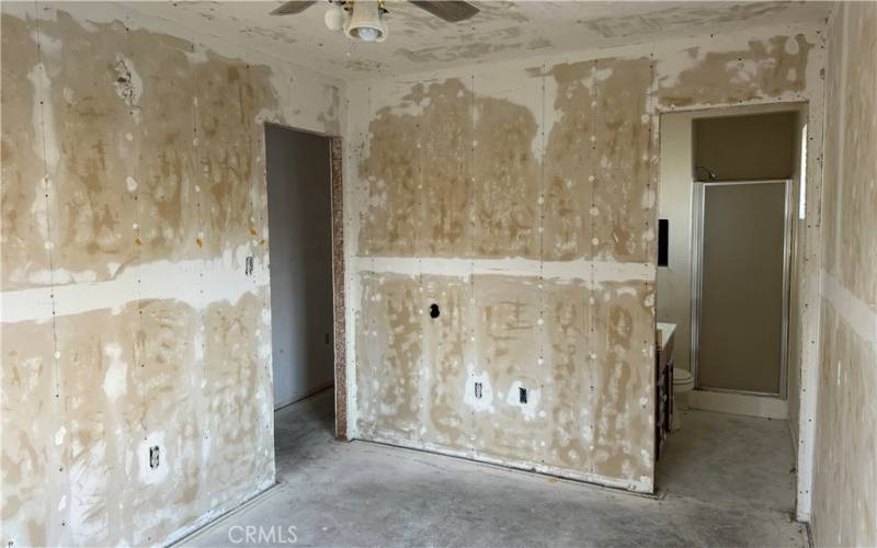 primary bedroom leading to primary bathroom