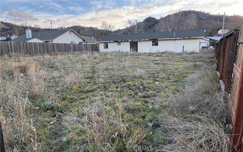  wide shot rear of house and back yard