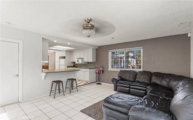 Large living room space open to kitchen. Direct access to laundry room.