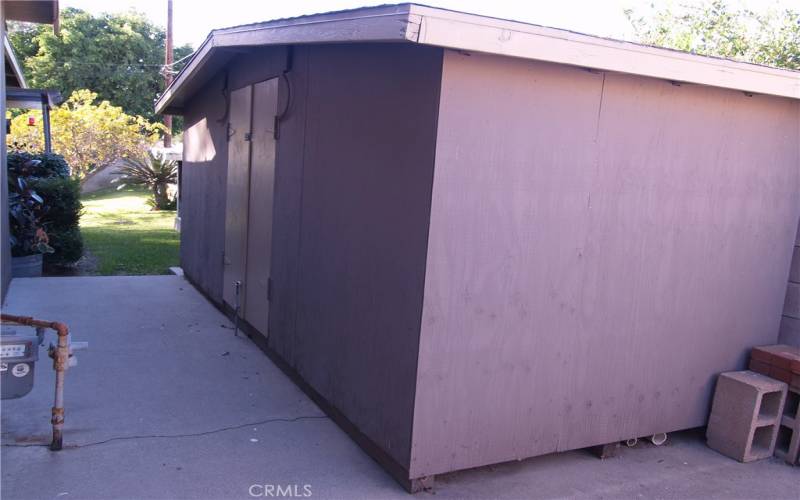 6 ft. deep X 15 ft. long custom built storage. shed with shelving.