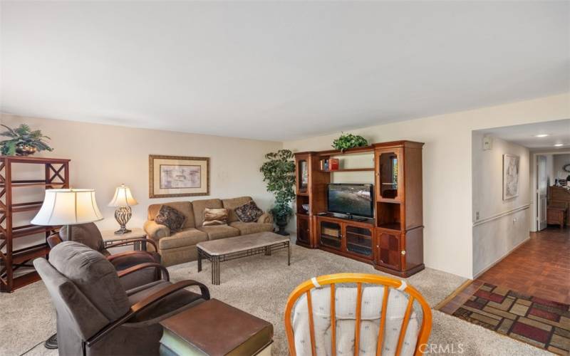 Spacious living room that opens into the dining area.