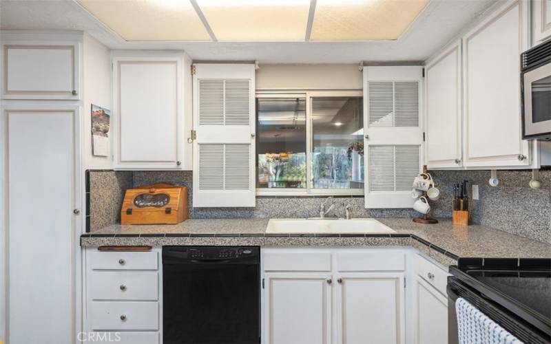 Kitchen includes upgraded appliances and ample cabinetry.