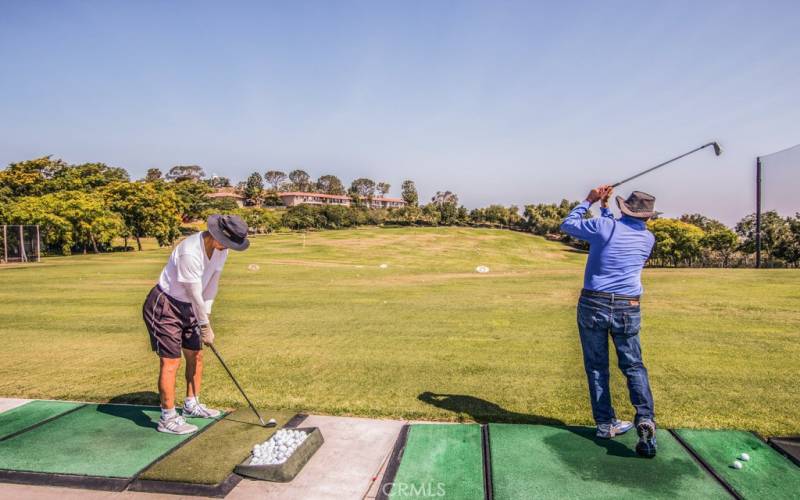 Practice your swing at the driving range.