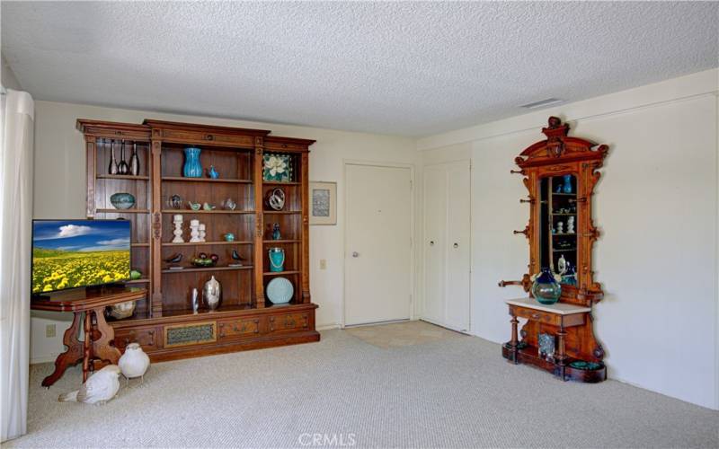 A view of the living room looking towards the entry door.