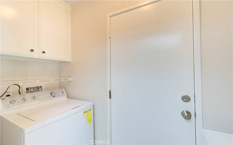 Laundry room with access to the garage