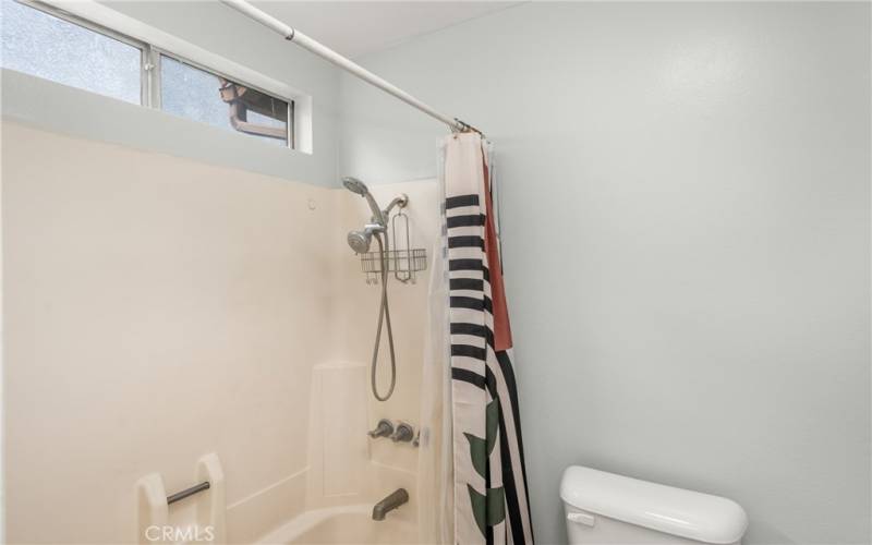 Full Bath (Tub) and Toilet in separate room adjacent to the room with the vanity!