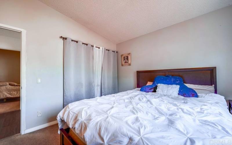 Deep closet in this bedroom as well providing space for shoes/clothes/storage