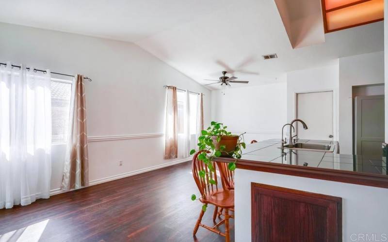 View from the kids work/play area back to kitchen & dining room; look at all the natural light