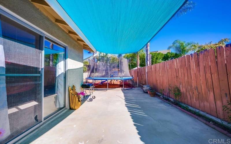 View from sliding glass doors leading from the open space area to this side and backyard