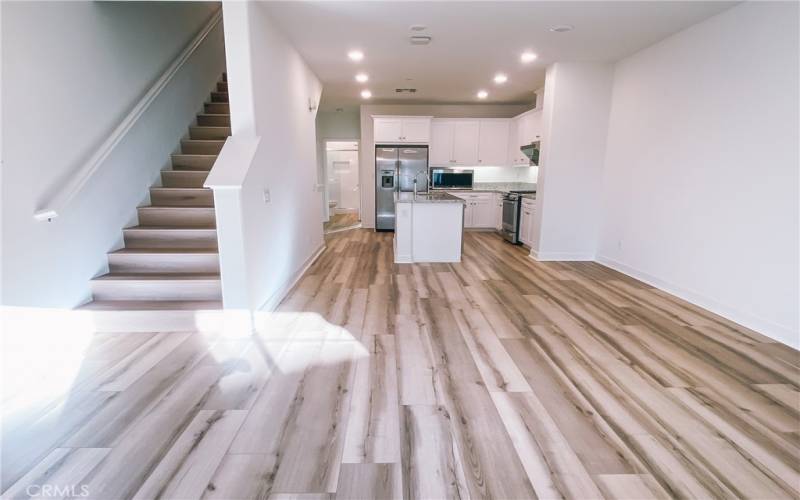 Dining room and living room areas are next to the kitchen.