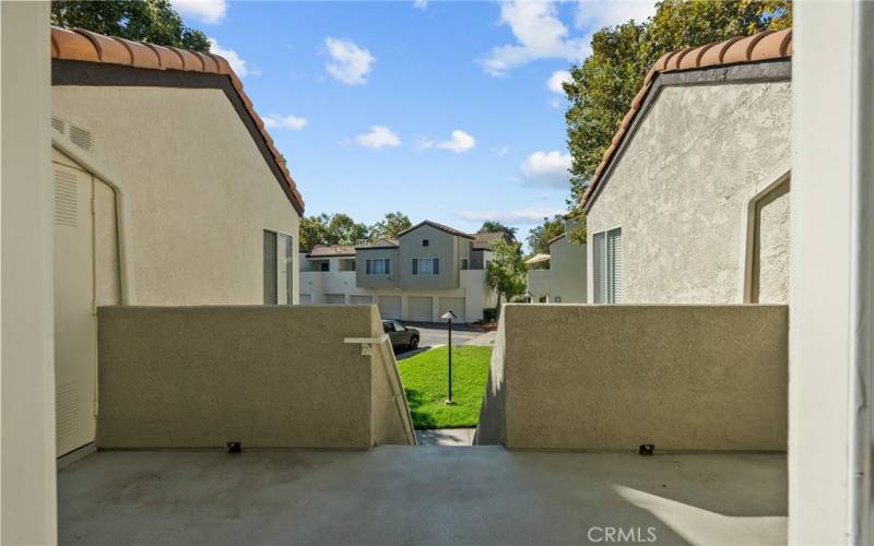 shot of patio to staircase from front door