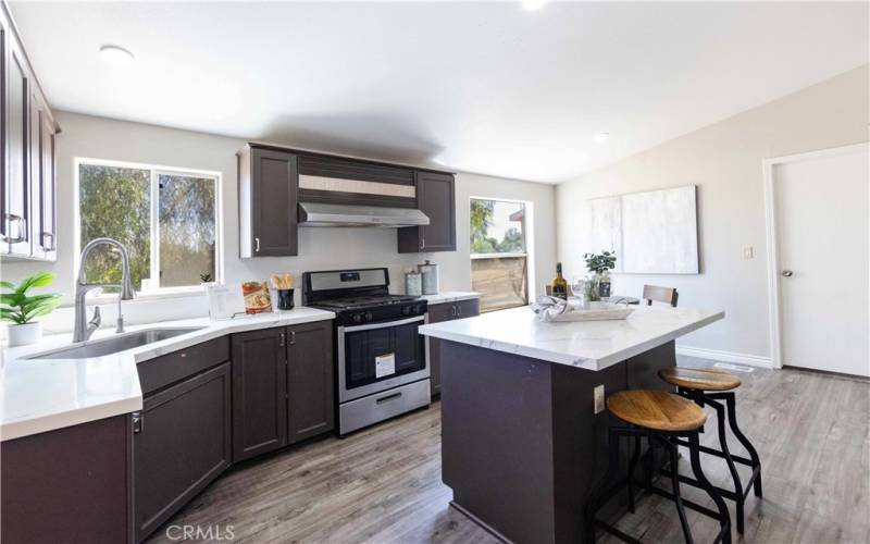 Kitchen w/ laundry room door in view