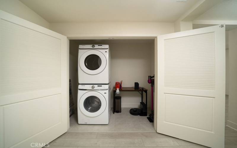 Spacious laundry closet with lots of storage space