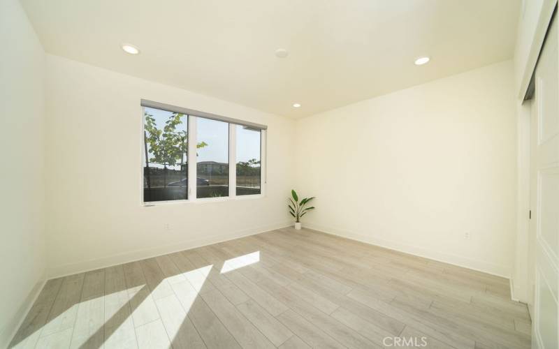 2nd Bedroom with lots of natural light and front porch view