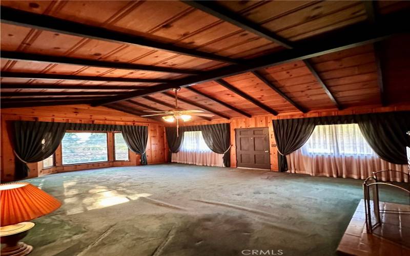 Family/Living Room, Front door flanked by two windows and far side bay window looking out to the gardens