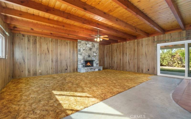 Large family room w/high beam ceiling & wood-burning fireplace!