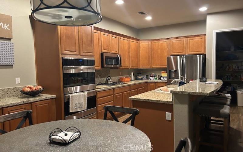 Kitchen has a walk-in-pantry.