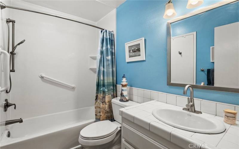 Fresh painted bathroom with updated bath and shower.