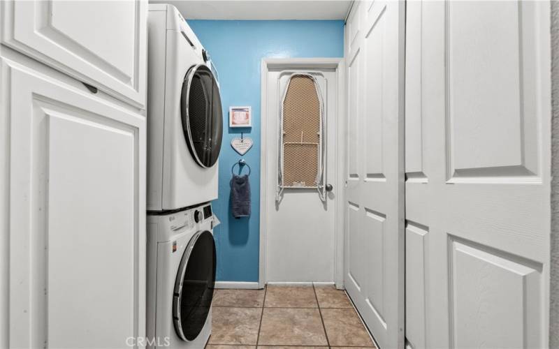 Laundry room with closet and bath through the door.