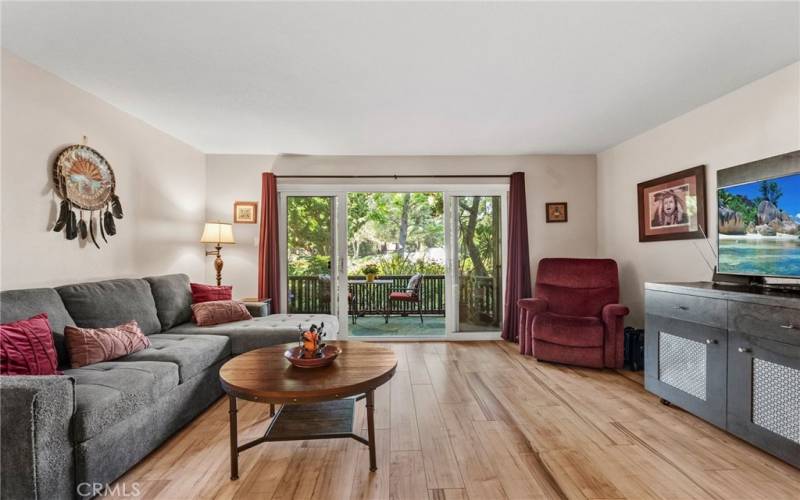 Another view of the living room looking to the patio and all the flora.