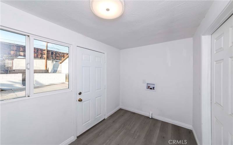 spacious laundry room behind the kitchen room