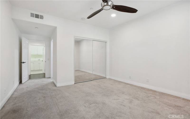 Additional bedroom has mirror closet