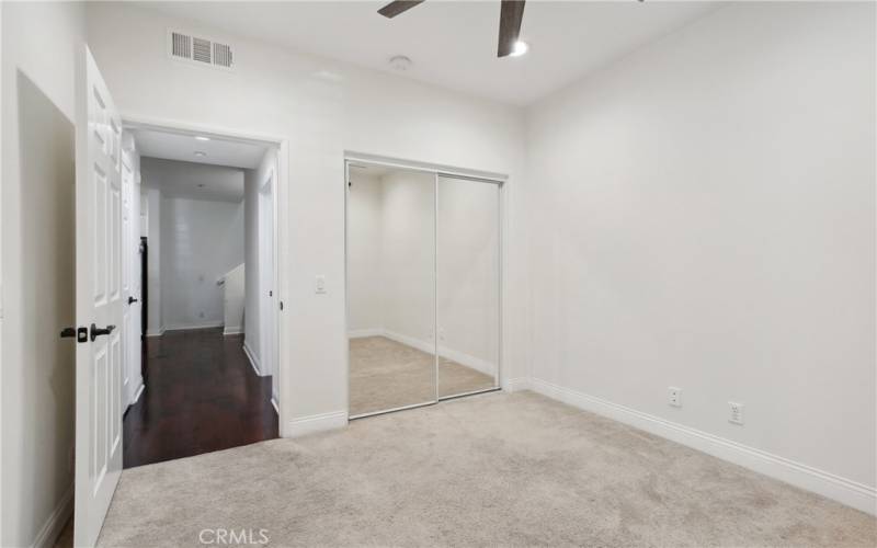 Downstairs bedroom has mirror closet