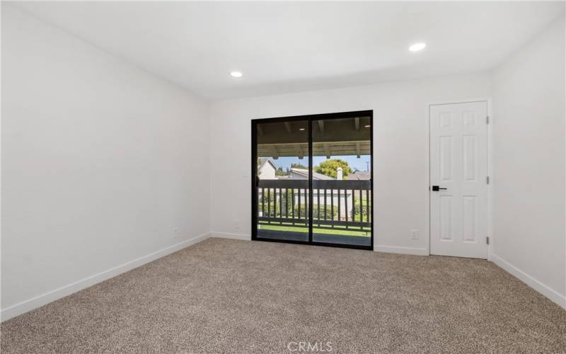 Spacious bedroom 2 has a balcony and lots of storage room