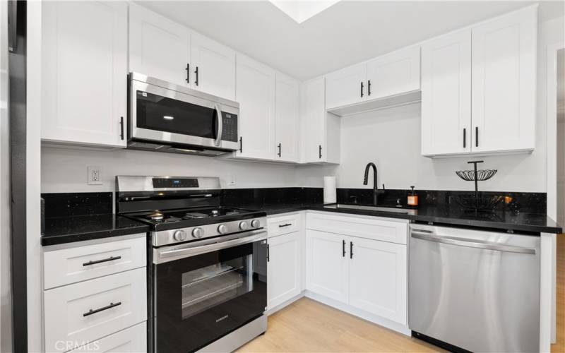 More kitchen views with all new appliances, countertops, and cabinets