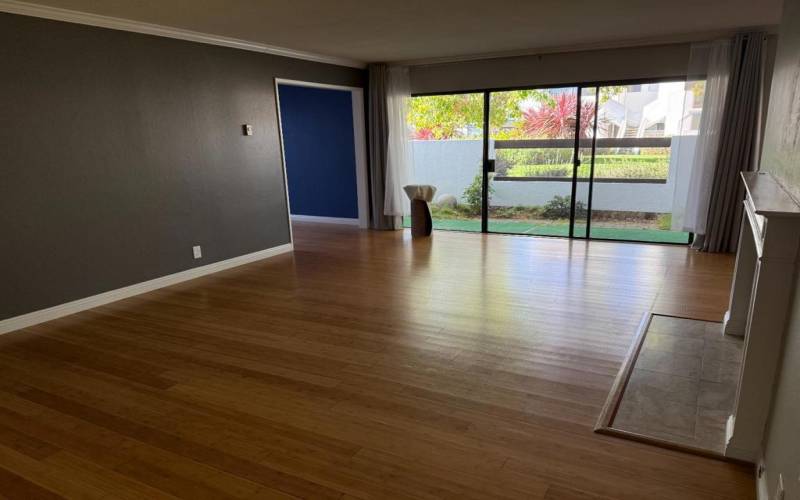 Living room equipped with gas fireplace and access to patio