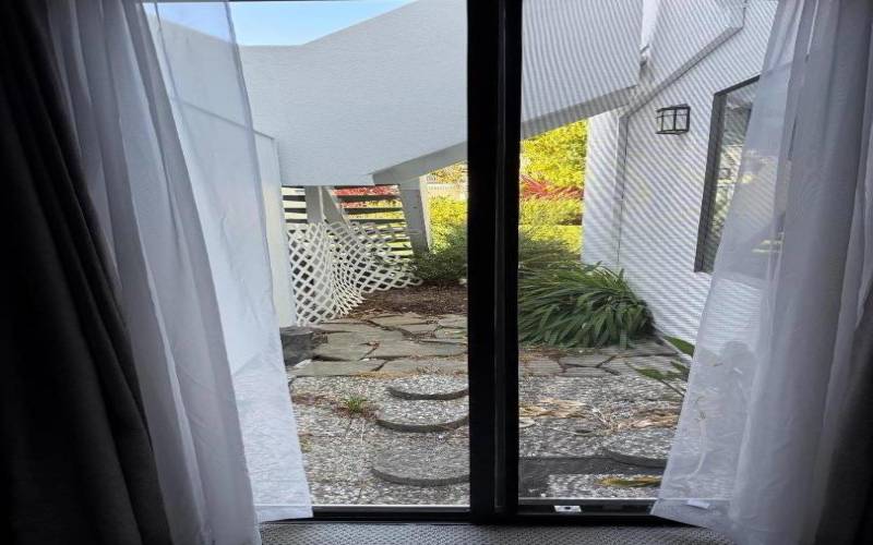 Master bedroom patio brings in sunlight