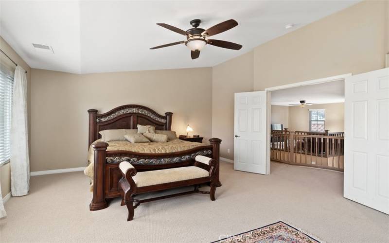 Grand primary bedroom with ample space.