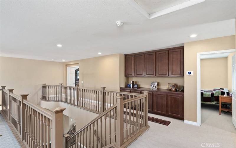 Open floor plan upon arriving at the top of second story landing.