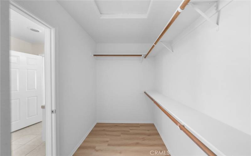 Walk-in closet in primary bedroom/bathroom