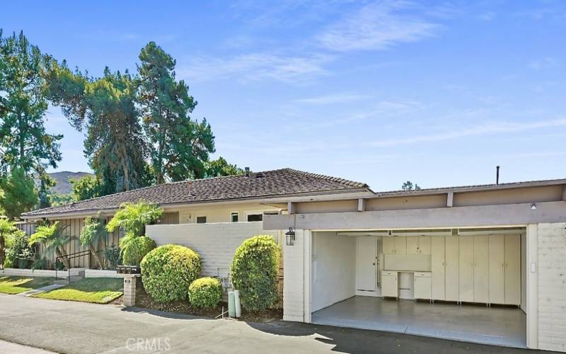 2-car garage with epoxy floor, built in cabinets, and overhead heavy duty storage.