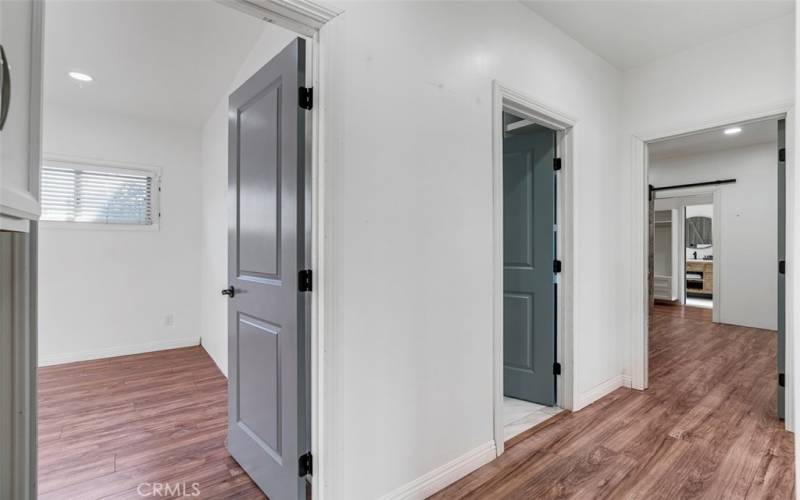 Hallway with access to Master Suite, secondary bedroom and bathroom.