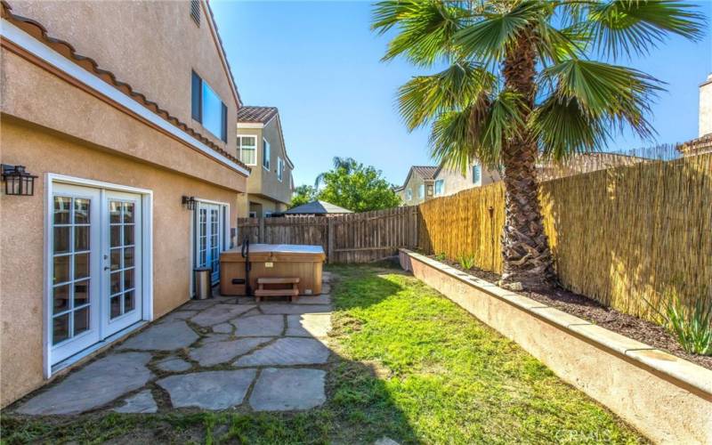 backyard w/ jacuzzi and french doors view