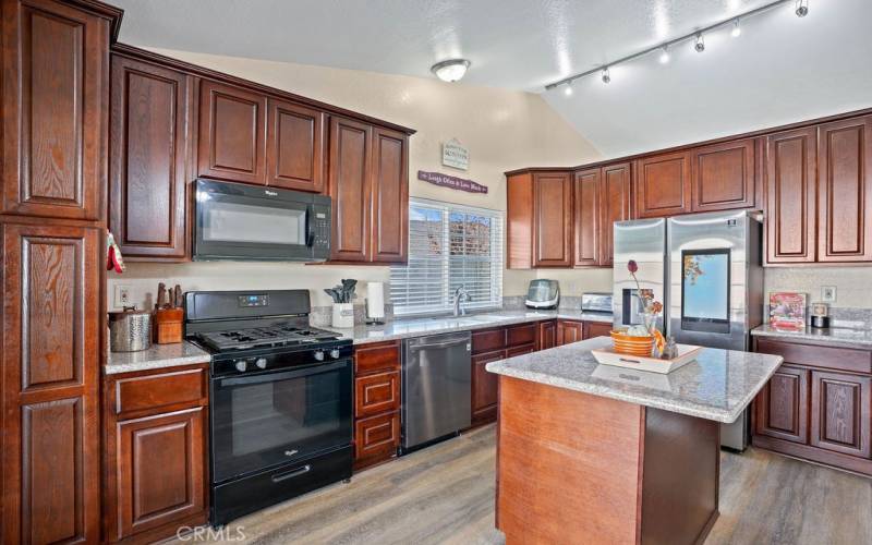 Great looking granite countertops - handsome cabinetry and perfect sized island for entertaining!