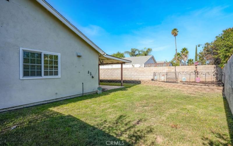 Large side yard on the EAST side of home. Gate to the left (not pictured)