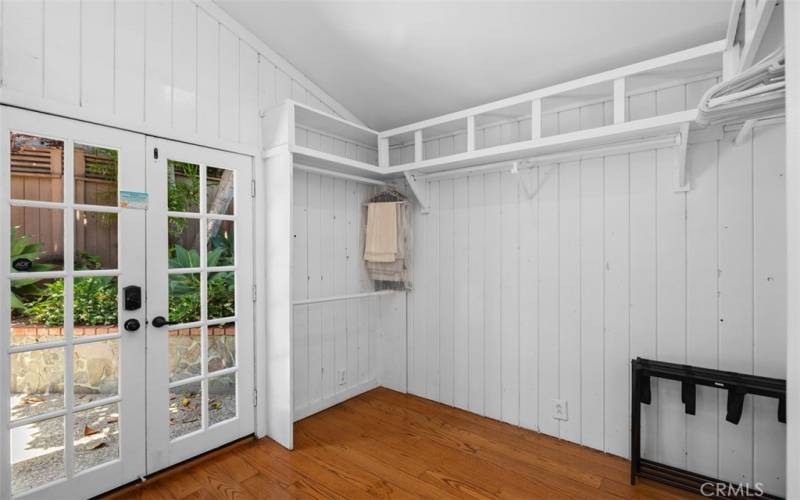 Primary closet with access to rear yard.