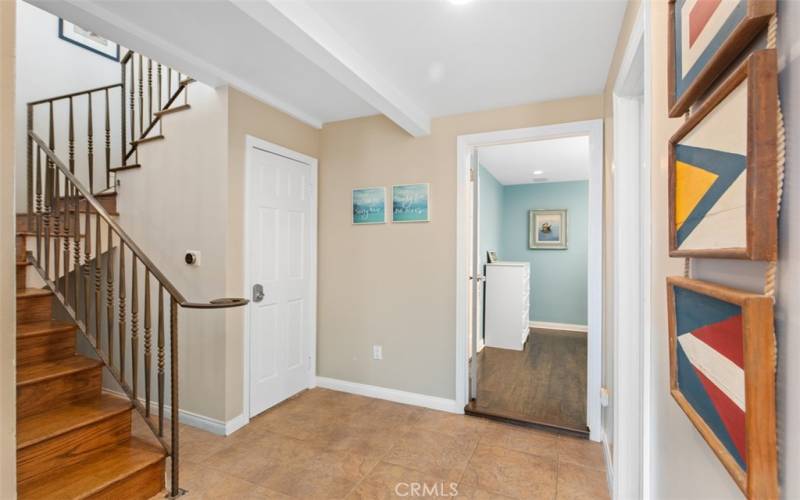 Hallway leading to bunkroom and stairs to upper level.