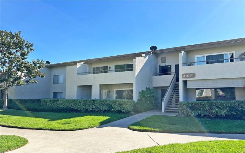 Upper unit with balcony overlooking park